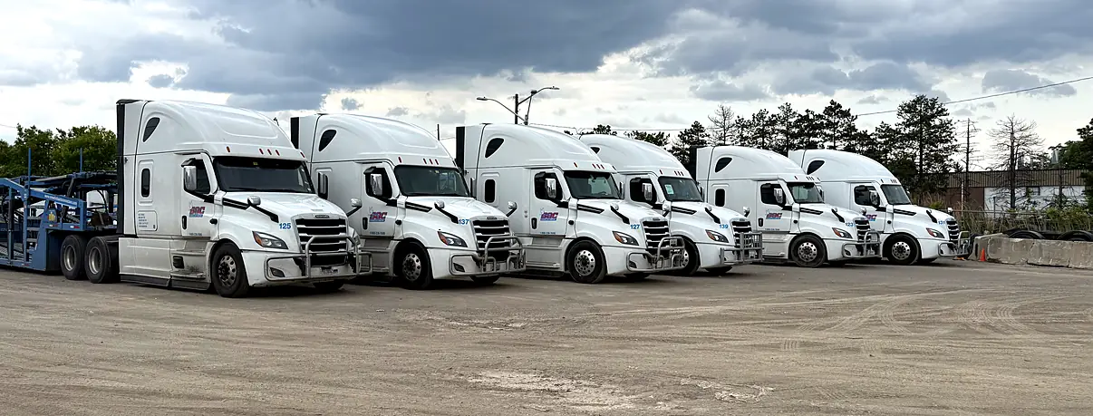 Row of Snowbirds Auto Connection company-owned trucks at the yard: the company you call owns the truck